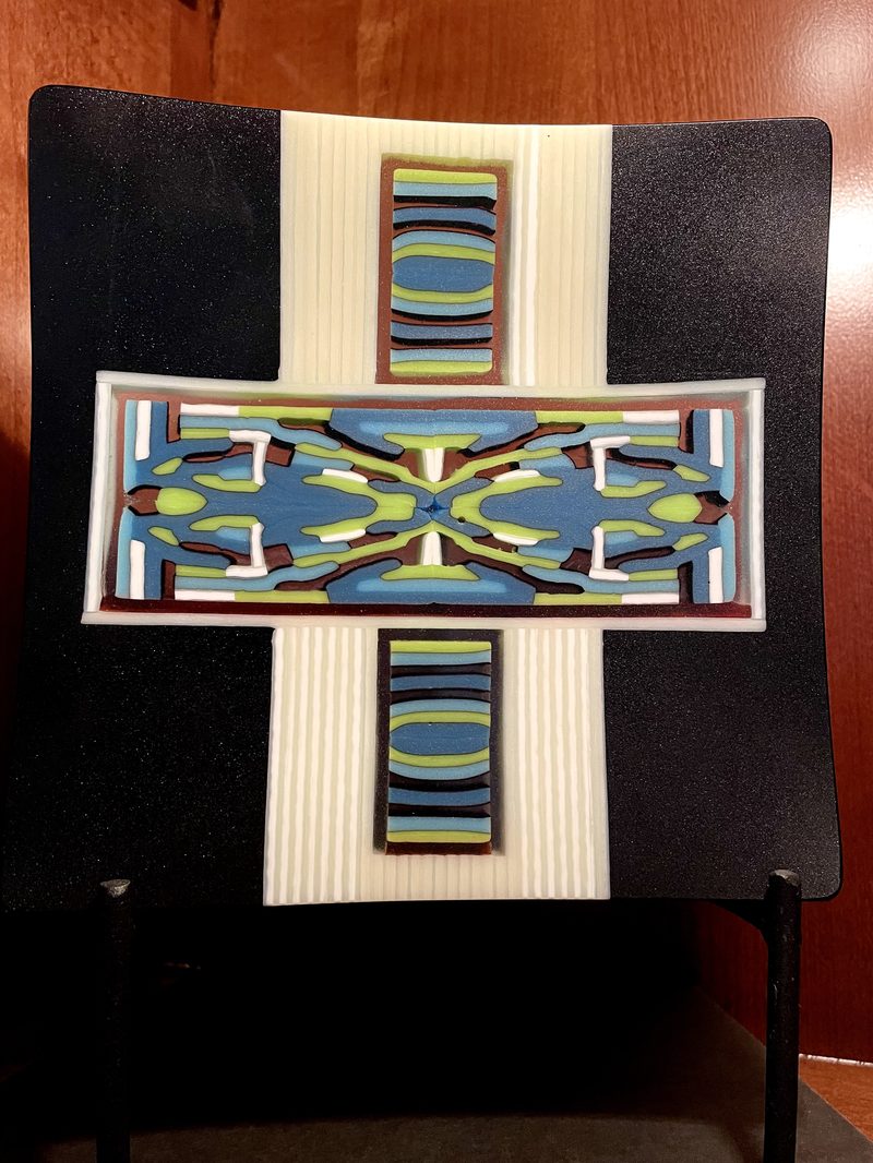 Cross pattern on black plate