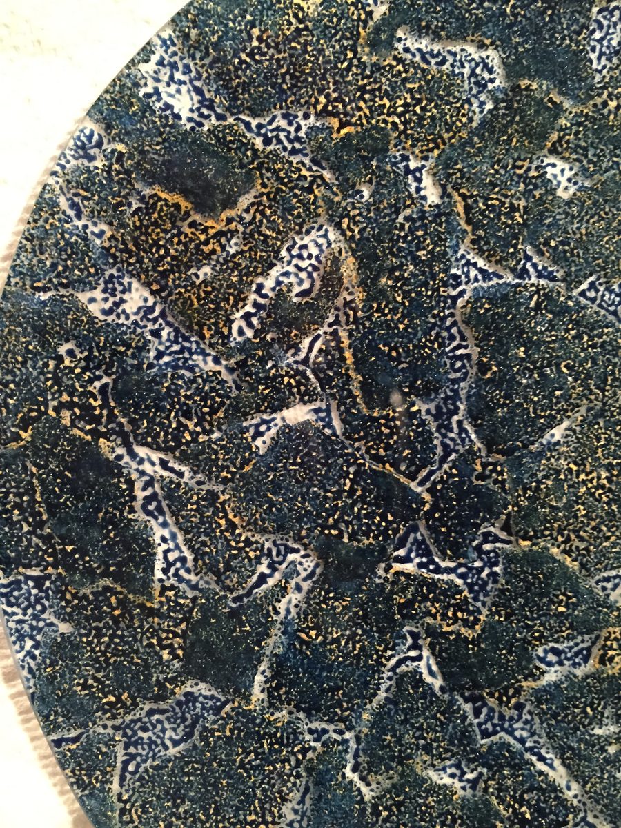 Dark patterned plate with gold veining