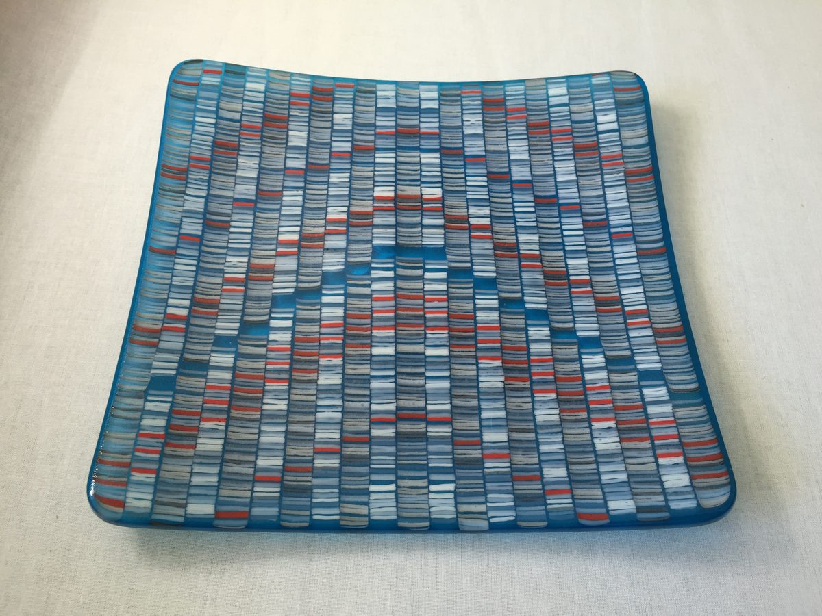 Square turquoise plate with grid pattern