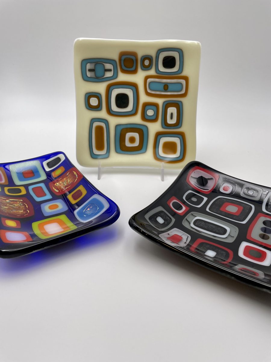 Three patterned platters on display