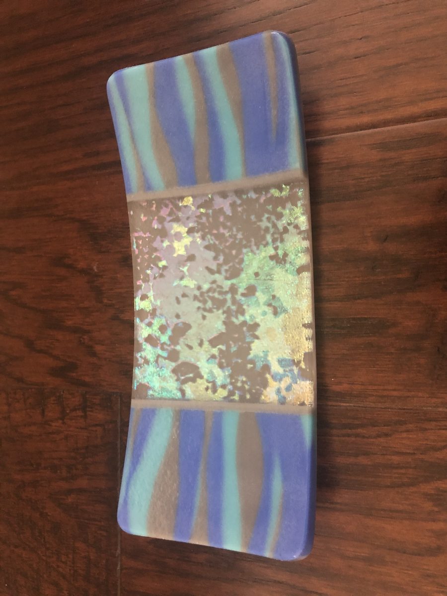 Panel with striped and decorative elements