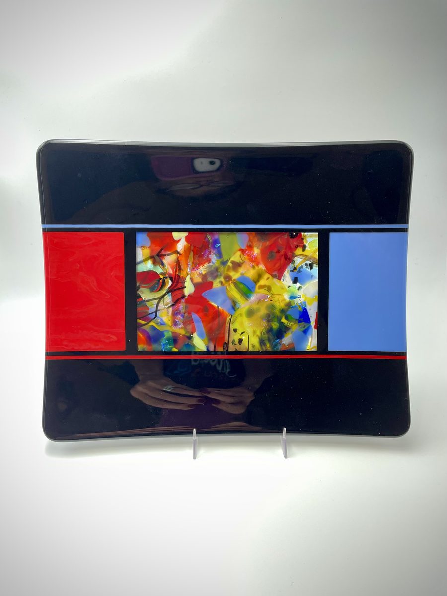 Black platter with colorful mosaic center